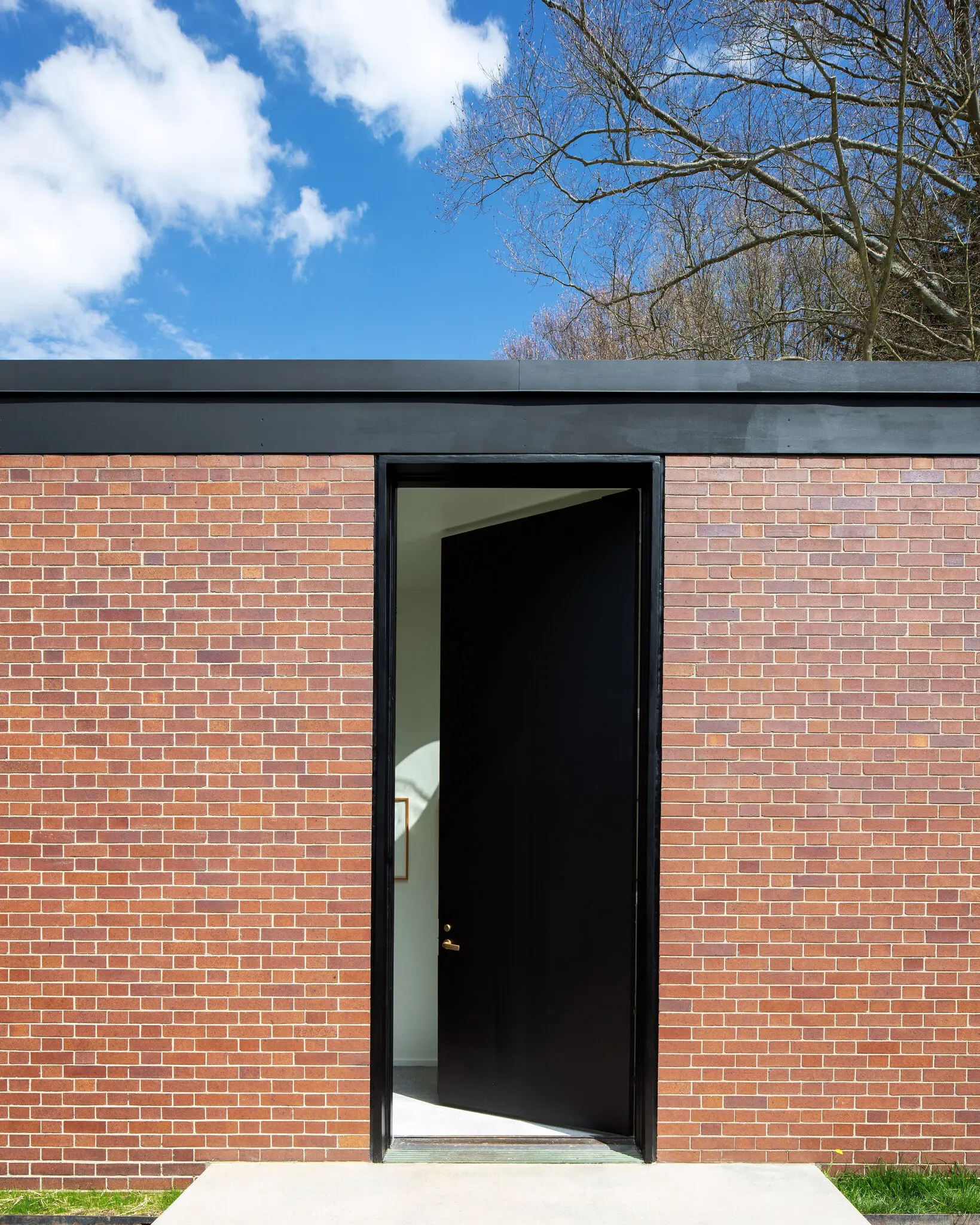 The brick house reopens: philip johnson's intimate guesthouse completes the glass house estate