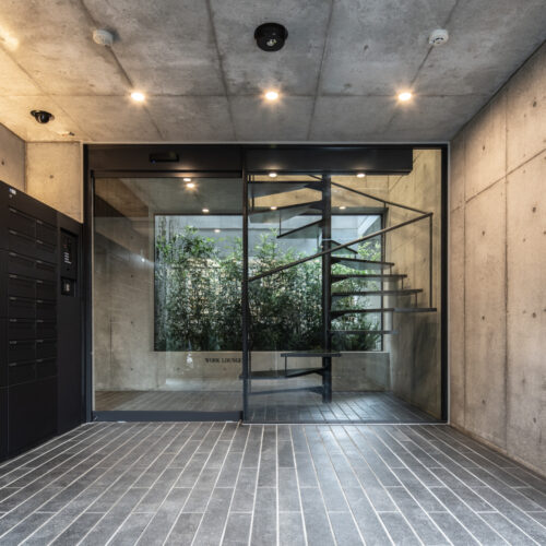 Aube toranomon residential building / ethnos