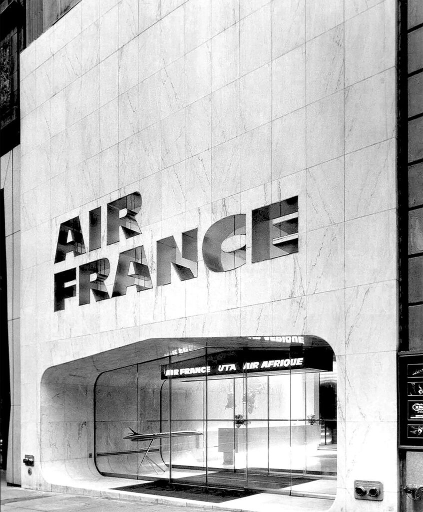 Air France's 1971 Midtown Manhattan office by Pierre Gautier-Delaye features stone-carved signage and a Concorde model inside. © Air France.