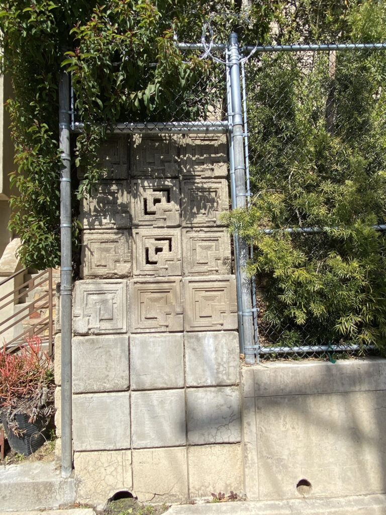 From a distance, the blocks resemble a letter "g," but viewed from below, they appear as concentric squares. A shift in angle reveals a likeness to the question mark blocks from super mario. © rachel presser