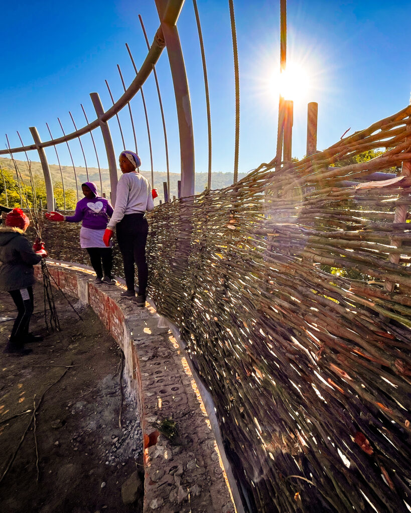 Community weaving the boma walls at Madwaleni River Lodge